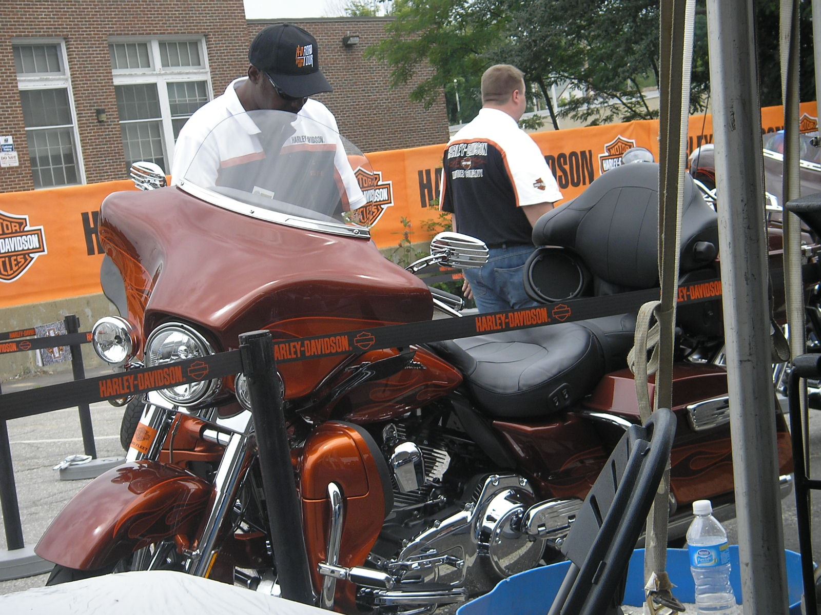 Harley employee getting a bike ready for a demo ride